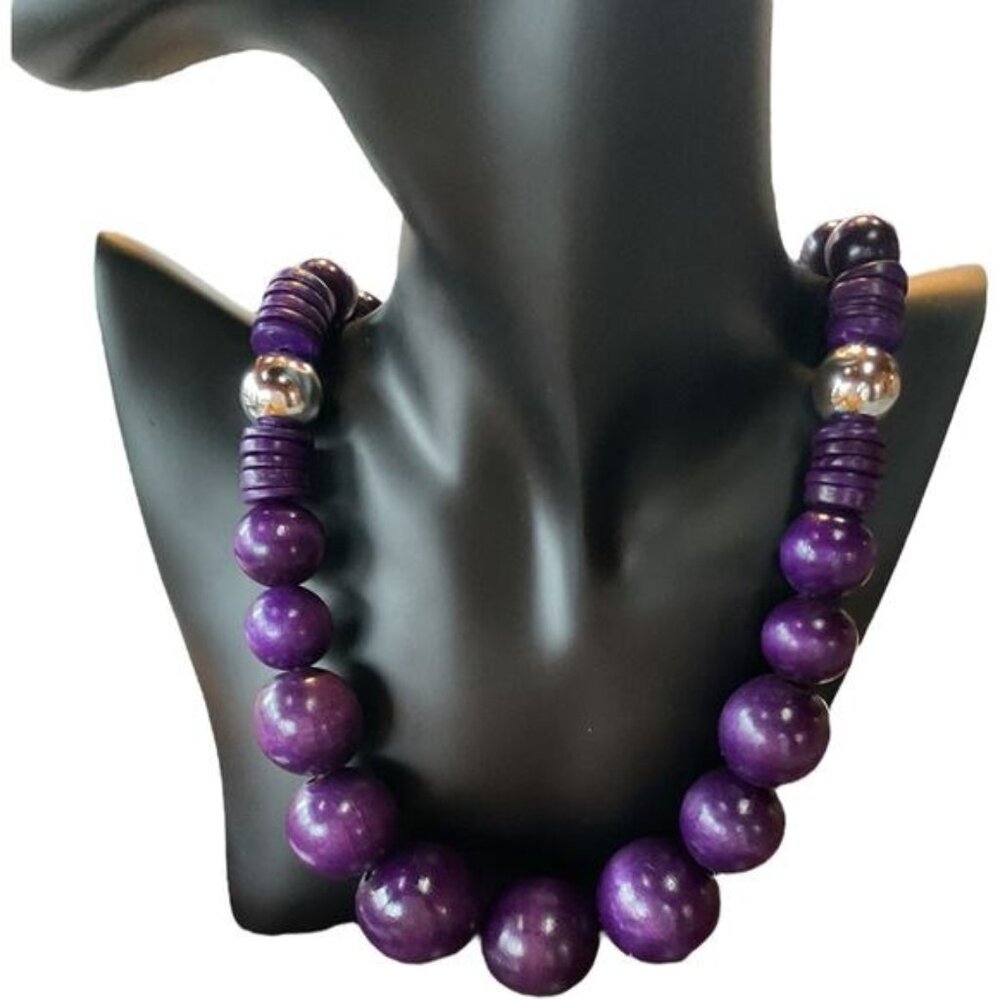 purple button back graduated bead necklace with two silver tone spacer beads